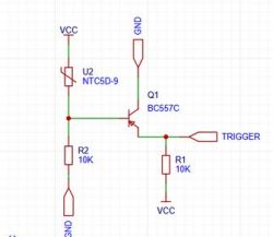 Fragment schematu: termistor NTC, tranzystor BC557C, dzielnik rezystorów i wyjście TRIGGER