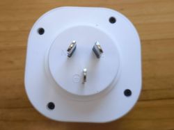 Three-Pin Electrical Plug Adapter Top view of a three-pin electrical plug adapter.