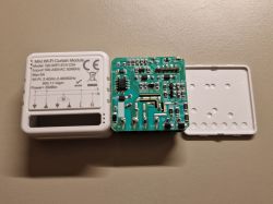 Opened Wi‑Fi curtain control module with exposed PCB and labeled white housing