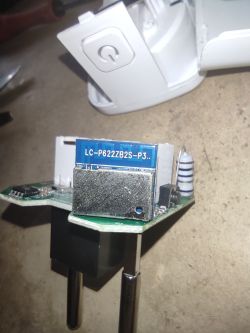 Inside of Zigbee Smart Socket after Disassembly Close-up of the disassembled interior of a Zigbee smart socket, showing the relay module and electronics.