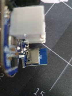 Electronic Module with ZTZS Marking Close-up of a circuit board with a module marked ZTZS and other electronic components.