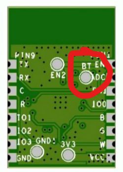 The image shows the underside of a module with pin labels and a red circle highlighting the BT_EN pad on the circuit board.