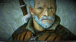 Pulpit systemu Windows 11 z tapetą przedstawiającą postać z gry Wiedźmin, bez widocznych ikon programów.