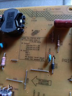 Close-up of power board model FSP123-3F01 with electronic components.