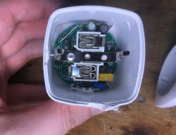 Interior of a Cheap WiFi Socket with PCB Module Interior of a cheap WiFi socket showing the PCB and electrical components.