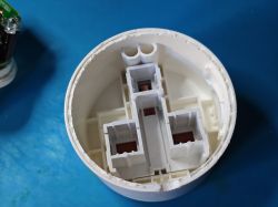 Sonoff S60TPG iPlug UK plug enclosure after disassembly The inside of an empty Sonoff S60TPG iPlug UK plug case with visible partitions, no electronics inside.