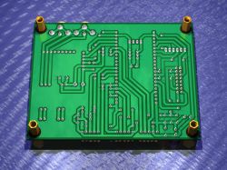 View of a single-layer PCB with yellow mounting standoffs