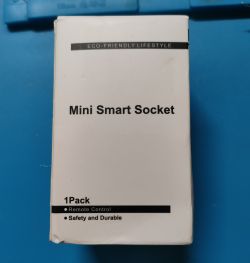 Packaging of Mini Smart Socket Packaging of a mini smart socket with the text Eco-Friendly Lifestyle, Mini Smart Socket, 1Pack, Remote Control, Safety and Durable.