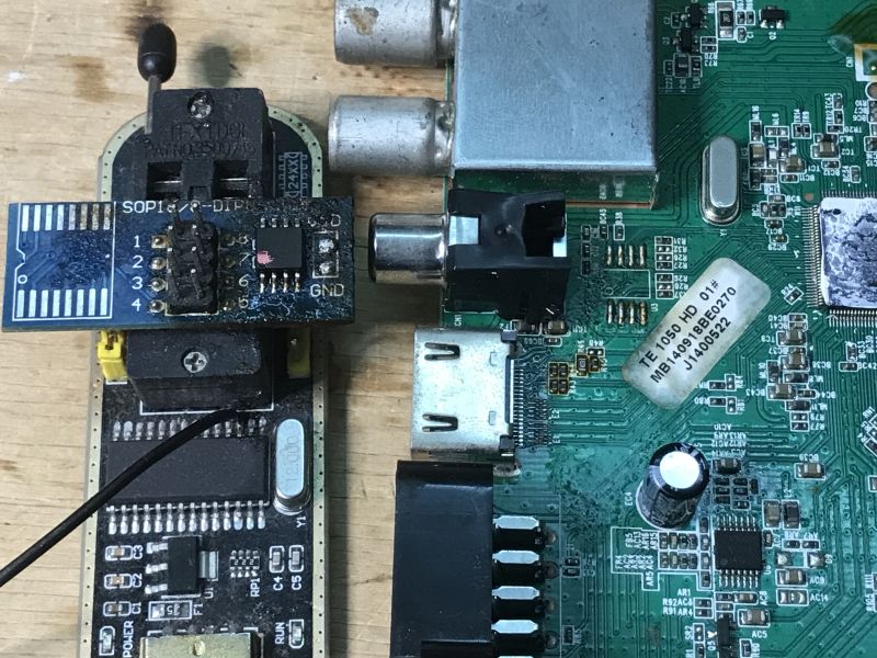 Close-up of the TE 1050 HD mainboard connected to a Flash memory programmer