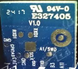 Circuit Board with Model Markings and Connection Points Section of a circuit board with markings and connection points.
