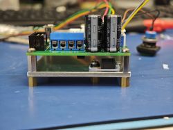 Prototype circuit board with mounted electronic components Close-up of a prototype PCB with capacitors, connectors, and wiring