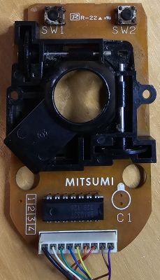 Electronic circuit of a Mitsumi mouse for Amiga, before restoration.