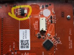 AMS1117 component on red PCB, regulator circled in yellow.