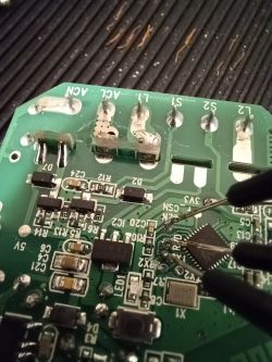 Programming a Smart Switch from Aliexpress Close-up of a circuit board from a smart switch with wires connected to specific points.