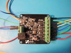 SP530E LED Controller with Connected Wires SP530E LED controller on a blue background with connected wires.