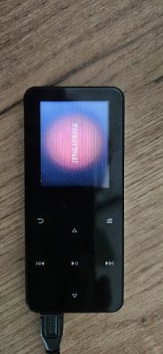 Odtwarzacz MP4 z komunikatem „Format Error!” na ekranie.