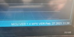 Stereo system display showing MCU and MP5 version information with model 7018B.