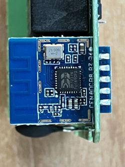 Close-up of an electronic circuit with components labeled 25.000 MHz and BK7231N.