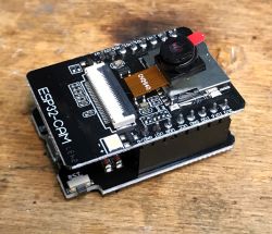 ESP32-Cam with OV2640 Camera ESP32-Cam module with OV2640 camera on wooden background