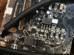 Close-up of PCB with Electronic Components Close-up of PCB electronic components with resistor and semiconductor labels.