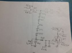 Hand-drawn schematic of a circuit with electronic components like diodes and transistors.