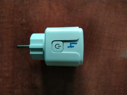 Smart Plug with Blue Marking Smart plug with button and blue marking.