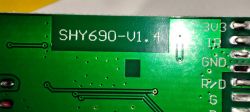 Close-up of a green circuit board labeled SHY690-V1.4 with visible solder points.