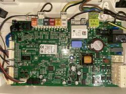 Close-up of a motherboard with numerous connectors and electronic components.