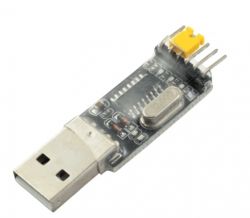 USB to UART adapter with a yellow jumper for selecting 3.3V voltage.
