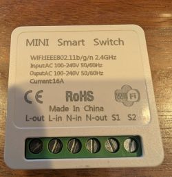 Mini Smart Switch with technical specifications label and screw terminals visible