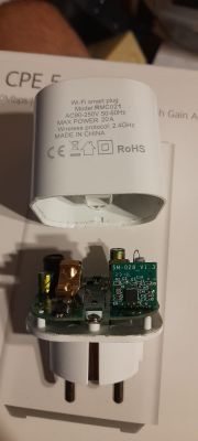 Wi-Fi smart plug RMC021 with open casing revealing internal electronics.