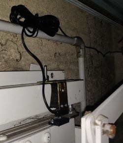 Wire Installation on Garage Door Installation of wires on the garage door frame.