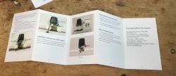 Jinvoo SM-AW713 Valve Controller Installation Guide Instruction leaflet of the Jinvoo SM-AW713 smart valve controller on a wooden table.