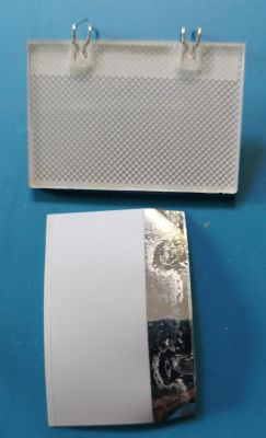 DIY backlight panel and a sheet of paper with aluminum foil.