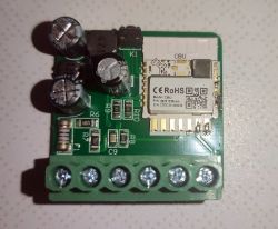Image of a dual digital meter with visible capacitors and a Wi-Fi module on a green PCB.