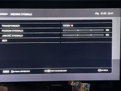 Ekran miernika sygnału z dekodera NC+ z wartościami 0% dla poziomu i jakości sygnału.