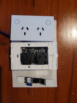 Front and internal parts of a Wi-Fi smart wall socket Au 2 Gang type.
