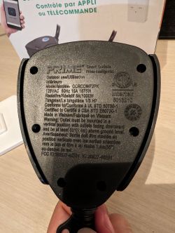 Back of Prime Smart Outlet Back of a Prime smart outlet with logo and specifications.