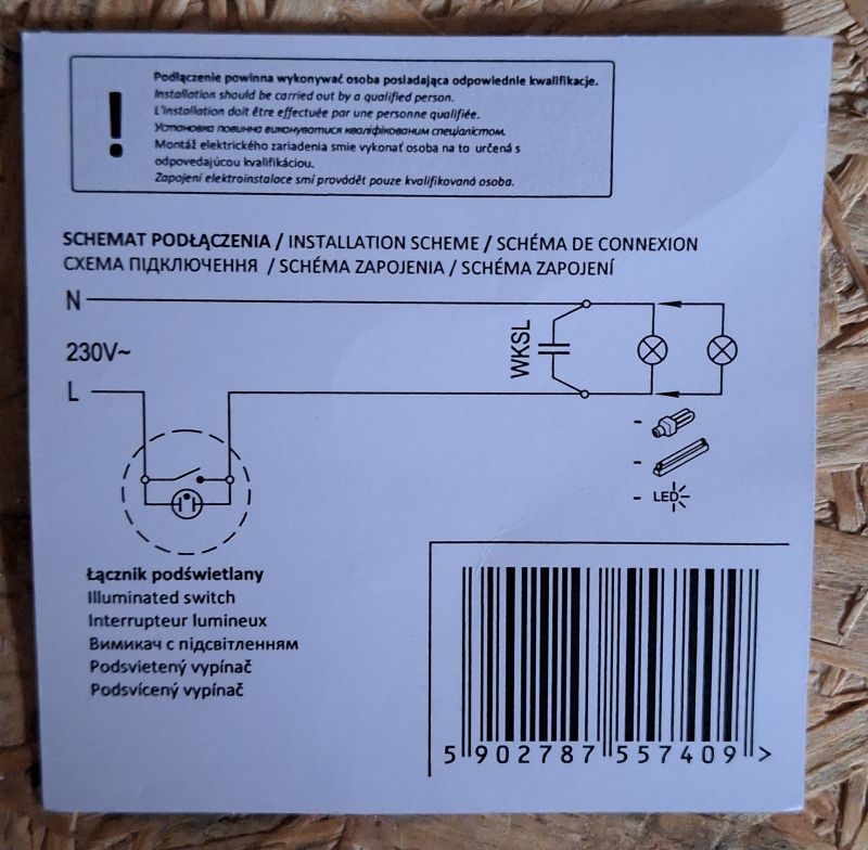 Schemat elektryczny z podświetlanym łącznikiem, dwoma żarówkami i kondensatorem.