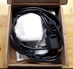 Tuya WiFi energy meter set in a box.