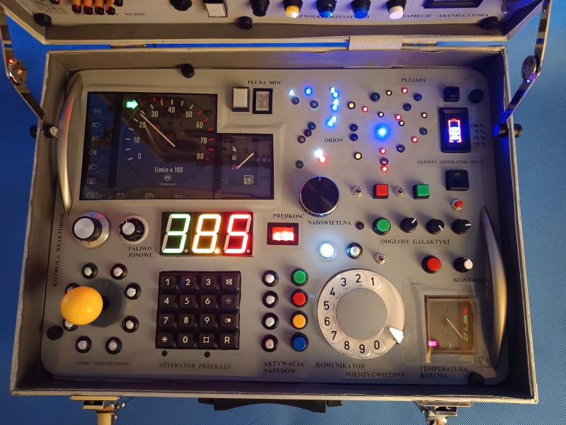 Voyager 3 Child's Control Panel A control panel of a toy Voyager 3 expedition control center with many buttons, indicators, and LED lights, installed in a suitcase.
