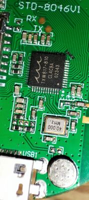 Close-up of a circuit board with TXW817-810 integrated circuit.