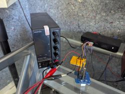 Laboratory Power Supply with Prototype Board Laboratory power supply and prototype board on a glass desk.