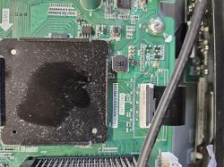 Close-up of a motherboard with TPD.NT72563.PB781 and 3NT725P2 labels visible