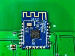 Blue WB03A electronic module with PCB antenna on a green printed circuit board