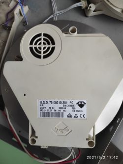 The image shows an electronic component with a label displaying technical data.