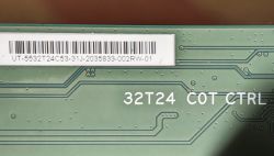 Close-up of a green PCB with “32T24 COT CTRL” marking and a barcode label