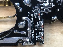 Close-up of a PCB in the Woox R4027 Power Strip Close-up of a section of a printed circuit board with markings ZLD-44EU(FR)-W-YT and electronic components.