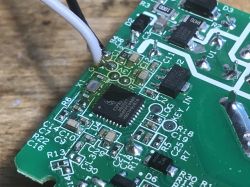 Circuit Board with ESP8285 Chip in Sonoff Mini R2 Close-up of a circuit board with an ESP8285 chip.