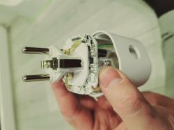 Interior of LIDL SAPM 1 A1 Smart Socket Interior of a LIDL SAPM 1 A1 smart socket held in a hand.